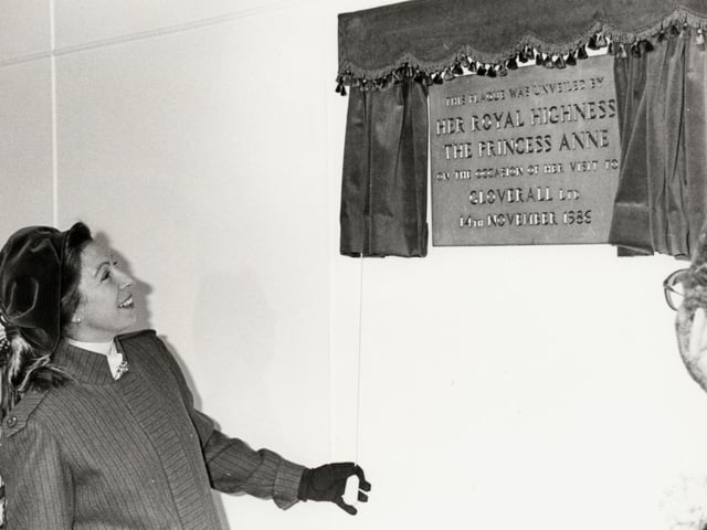 Princess Anne unveils a commemorative plaque during a visit to the Gloverall factory in Wellingborough in 1986