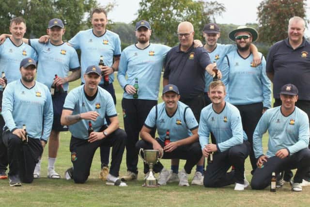 Loddington & Mawsley pose for the camera after their Division One Knockout Cup final success. Pictures by Finbarr Carroll