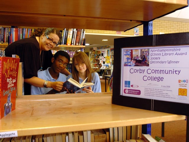 Librarian Amy McKay and pupils Nyasha Matsiga, 15, and Vanessa Bylica, 14. July 2008