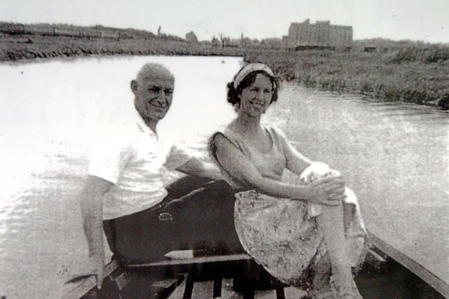 River Nene at The Embankment. 1950's Jean Jaeger and husband boating on the River Nene with Whitworths mill in background