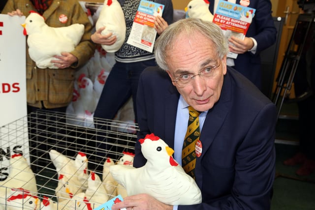 Cluck Off: Wellingborough: Camapign against chicken farm near Rushden and Higham -  Peter Bone MP with a chicken in 2018