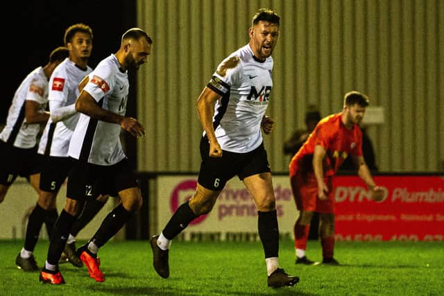 Rory McAuley celebrates his last-gasp equaliser for Corby Town (Picture: Jim Darrah)