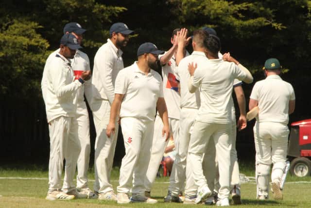 Division One leaders Rushden & Higham Town celebrate a wicket during their victory over Thrapston. Pictures by Finbarr Carroll
