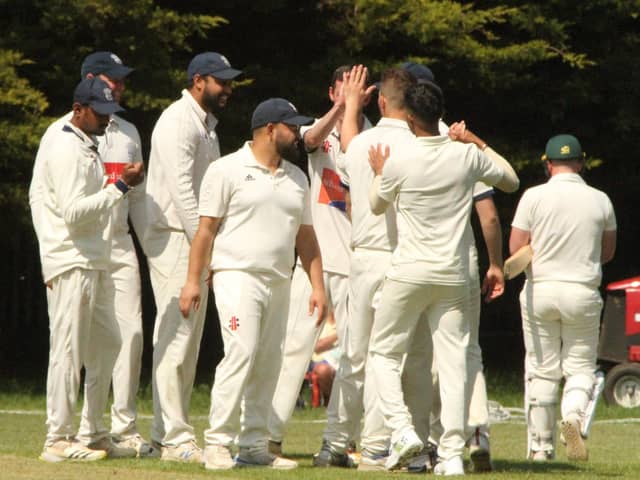 Division One leaders Rushden & Higham Town celebrate a wicket during their victory over Thrapston. Pictures by Finbarr Carroll