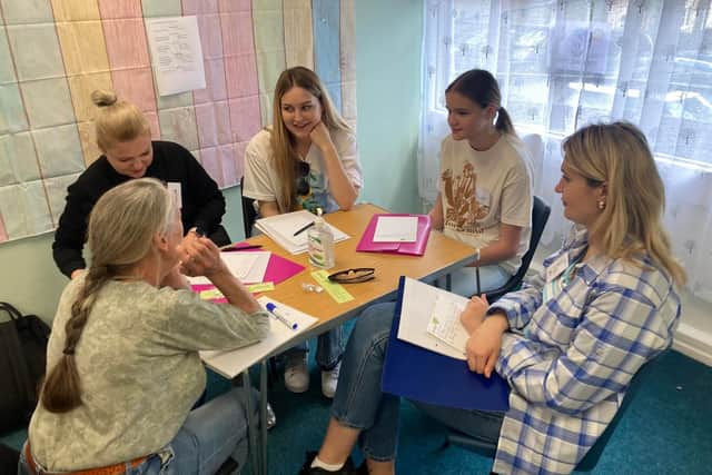 Qualified teachers have volunteered their time to help members of the group learn English