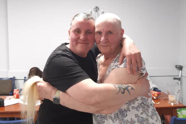 Daughter Gemma Smallbones hugs mum Sandra Brown after the brave the shave event in Desborough