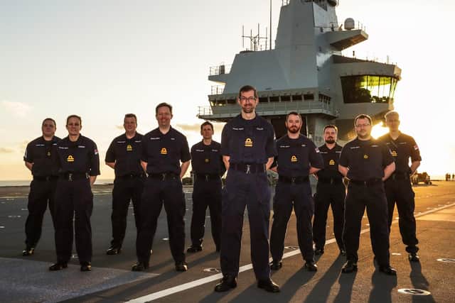 Aircraft Controllers onboard HMS Queen Elizabeth. With Commander Pickles in the centre
Credit: LPhot Dan Rosenbaum