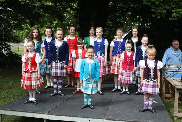 The girls from the Skelding School of Highland Dance are performing on the Rowlett Stage
