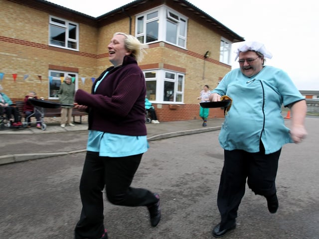 WELLINGBOROUGH, Bilton Court care home staff taking part in a pancake race 2010