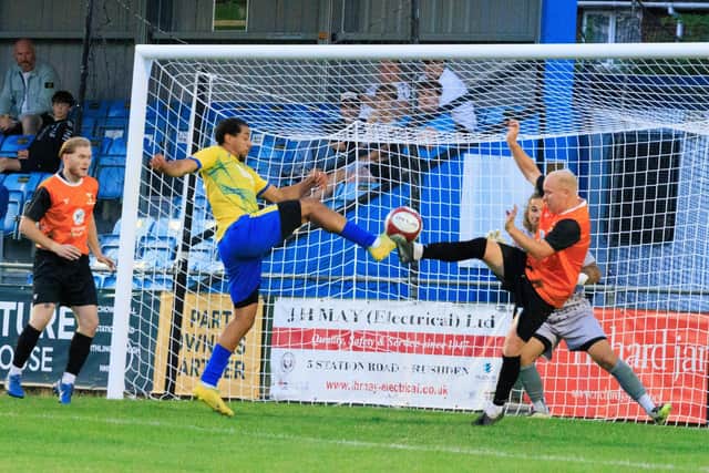 Wellingborough Town's Glenn Walker is denied (Picture: Shaun Frankham)