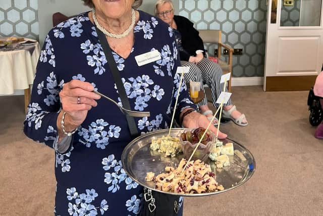 Resident Ambassador Janet serves up cheesy delights