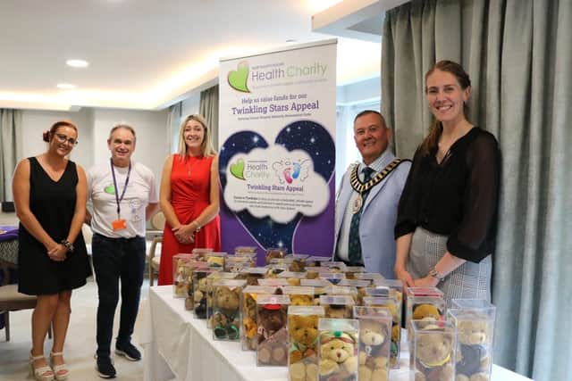 Staff, Mayor of Thrapston Cllr Andy McGovern, Nick Hayton, and Fiona Stacey