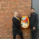 Business Manager Meghann Ball and Franchisee Supervisor Jamie DeRosa unveil the new defibrillator at McDonald’s Kettering High Street