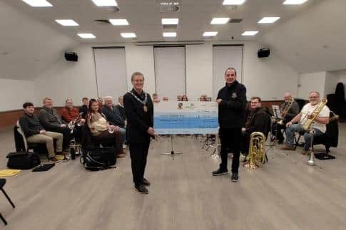 A cheque was presented to the band by Cllr Richard Levell in January Image: Raunds Town Council