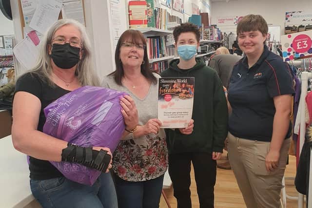 Slimming World members have been donating unwanted clothes to the Corby Cancer Research UK store