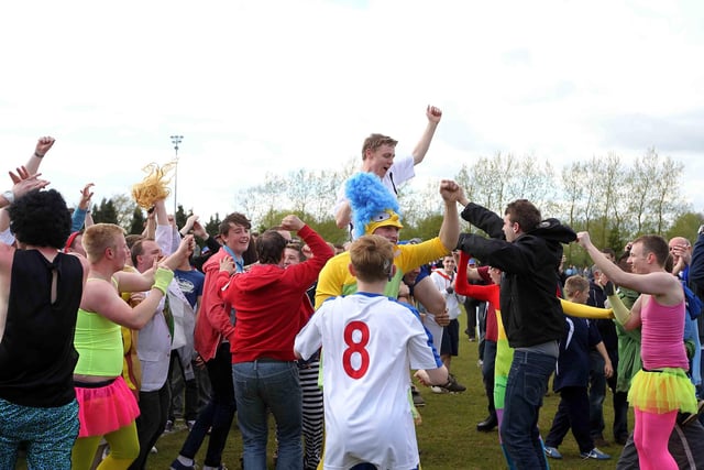 AFC Rushden & Diamonds players and fans celebrating promotion.