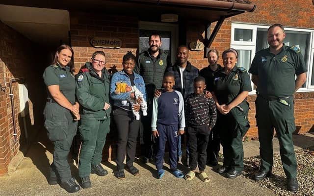 Left to right - Lisa Hawkins Technician, Kate Kempinska Specialist Practitioner, Nwadimma Chioma Okorie and baby Bryan, Matthew Crawford Duty Commander, Charles Chibueze Okorie, Richard Chimeremeze Okorie , Kesean Somtochukwu Okorie, Abbie Thompson Student Paramedic, Wendy Honour Technician and Jack Gane Paramedic.
