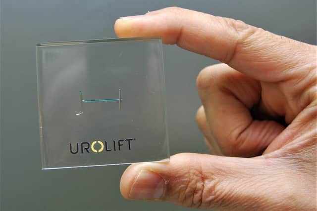 The tiny Urolift device encased in plastic