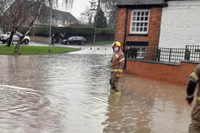 Firefighters attend the flooding