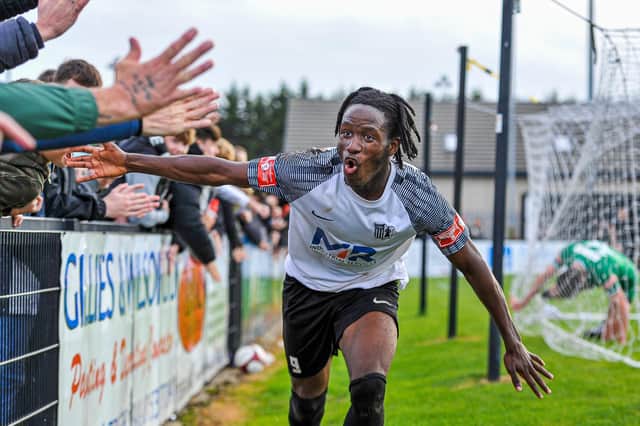 Tsaguim Florian celebrates after he scored Corby Town's third goal in their 3-0 success over Dereham Town at Steel Park. Pictures by Jim Darrah