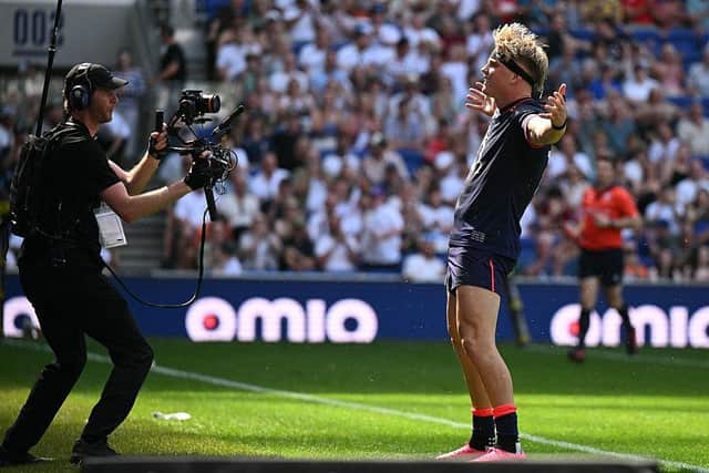 Henry Pollock celebrates after completing his hat-trick for England