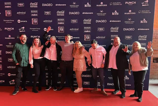 The Red Lion team celebrates their win at The Great British Pub Awards 2024