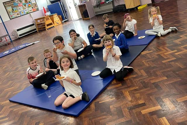 Young carers enjoying a slice of pizza at the school’s first Young Carers Evening