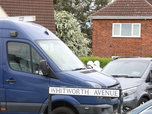 Officers are searching a property in Corby
