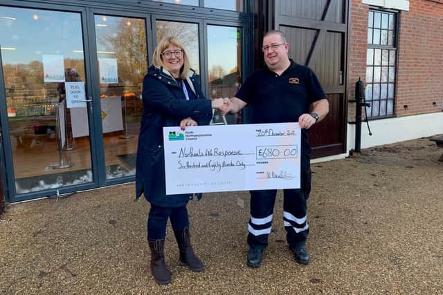 Cllr Helen Howell presents £680 to Wayne Fisher from Northants 4x4