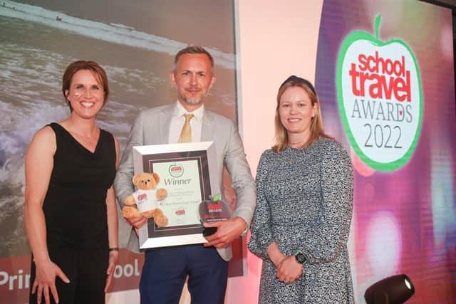 Headteacher John Wayland with the award.
