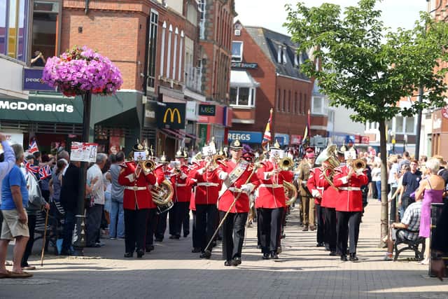 Kettering: 2nd Battalion Royal Anglians marching through Kettering town centre. July 2014/National World