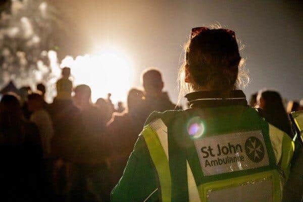 A St John Ambulance volunteer on duty at a firework celebration.