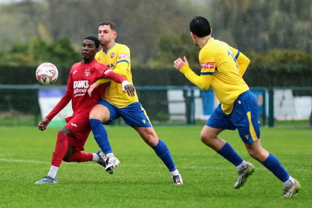 Wellingborough Town's Lloyd Buckby battles for the ball during his side's 5-4 win over Coleshill Town at the Dog & Duck on Saturday (Picture: Rob Webb)