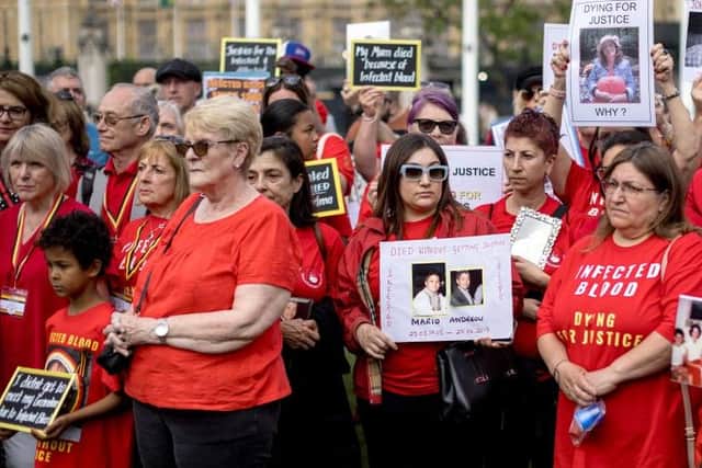 Sue Wathen and campaigners affected by the infected blood scandal attend a vigil in Parliament Square on May 19, 2024 /Photo by Jack Taylor/Getty Images