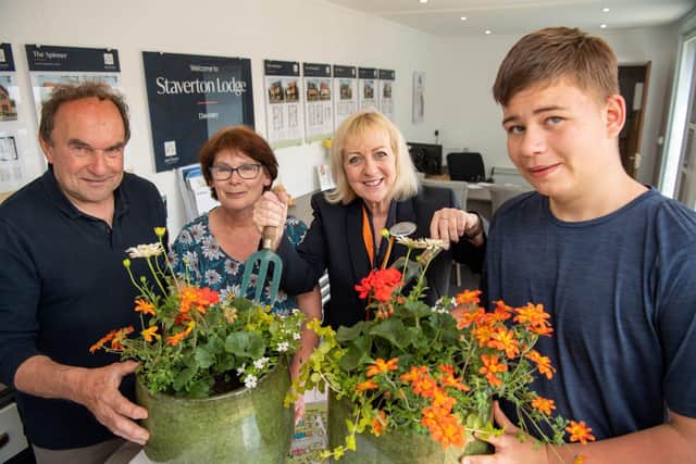Tim, Heather and Dominic, 15, from Green Acres Farm CIC with Bellway Sales Advisor Lynne 