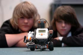 Gareth Gregory, 13, and Dalian McGuffie, 12 with the robot they have been programming to dance, June 2007