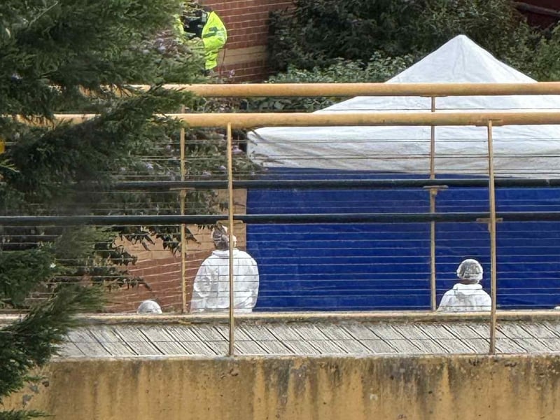A forensics tent was erected on the footpath on Friday morning.