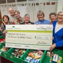 BN - SGB-31736 - The team at Weston Favell Foodbank with the cheque from Barratt Homes