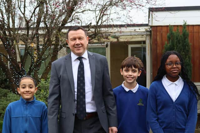 Andrew Burns with students from Beanfield Primary School, part of Brooke Weston Trust.
