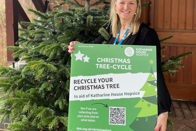 Carley Lambourne, Katharine House Events & Challenges Officer, promoting the hospice’s Christmas Tree-cycle scheme.