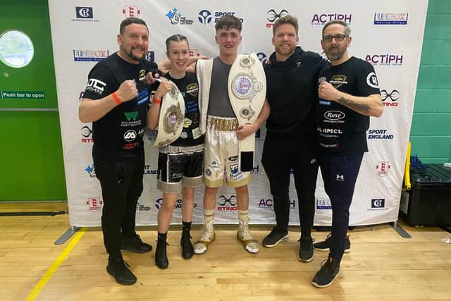 Lauren Mackie, Ellis Panter and their coaching team pose for the camera after their national title successes in Solihull