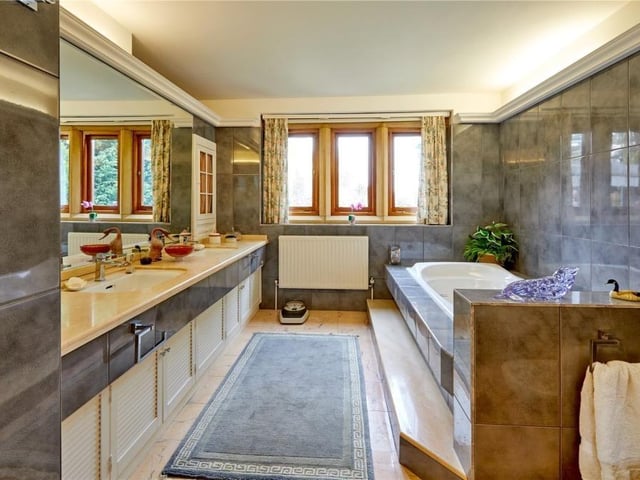 The home has traditional features as well as an indoor swimming pool, equestrian facilities and extensive parkland.