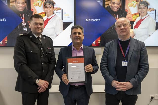 Perry Akhtar receiving his award
