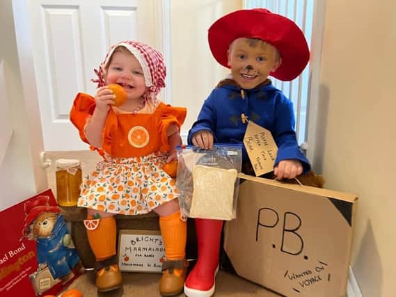 George, 4, as Paddington, has roped in little sis Maddison, 1, as his marmalade