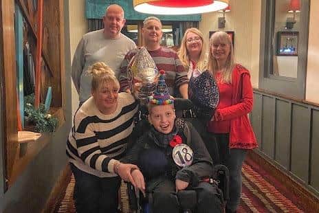 Zak with his family on his 18th birthday, three months before he died. With Zak is mum Vicki Fairhurst. Back row: Zak's uncle John, his dad, his sister Hannah and gran Elma. Image: The Fairhurst family