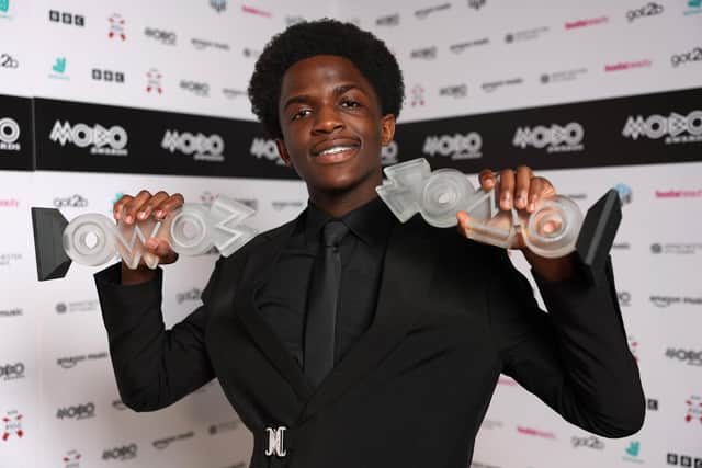 DC3 poses with the award for Best Gospel Act and the Best Newcomer award inside the winners' room during the 2026 MOBO Awards at Co-op Live. (Photo by Shane Anthony Sinclair/Getty Images for MOBO)