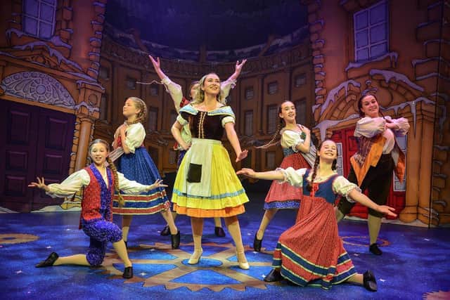 The 2023 Junior Ensemble performing on stage with Cinderella