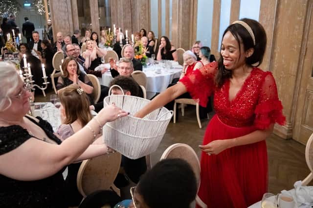 Lorraine Lewis picking a winning raffle ticket at last year's ball