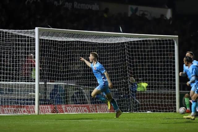 Luca Miller runs away to celebrate after scoring for the Poppies to make it 1-1 at Sixfields (Picture: Peter Short)