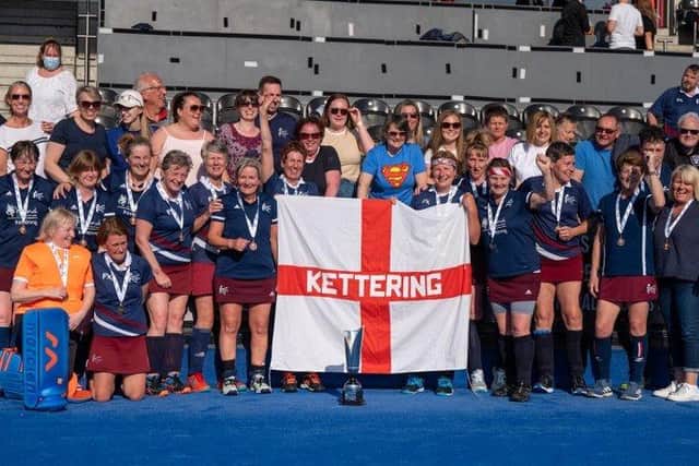 Kettering Hockey Club's Over 55s players and supporters celebrate after they won the National Cup